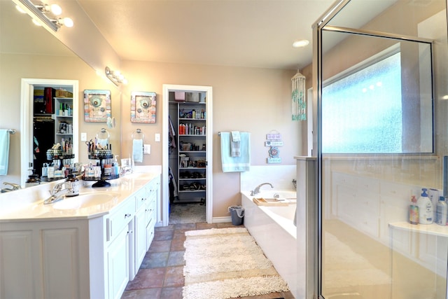 bathroom featuring vanity and plus walk in shower