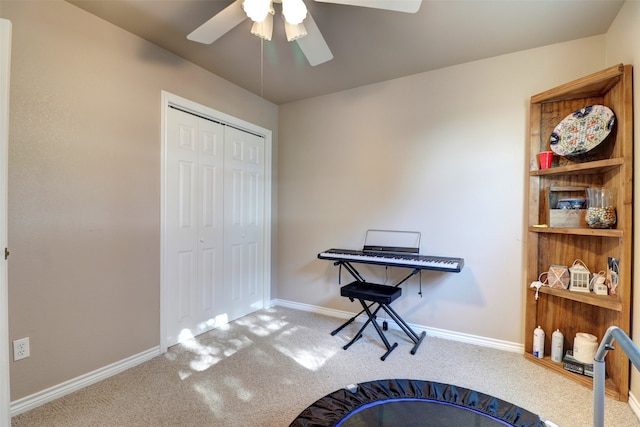 misc room with carpet floors and ceiling fan