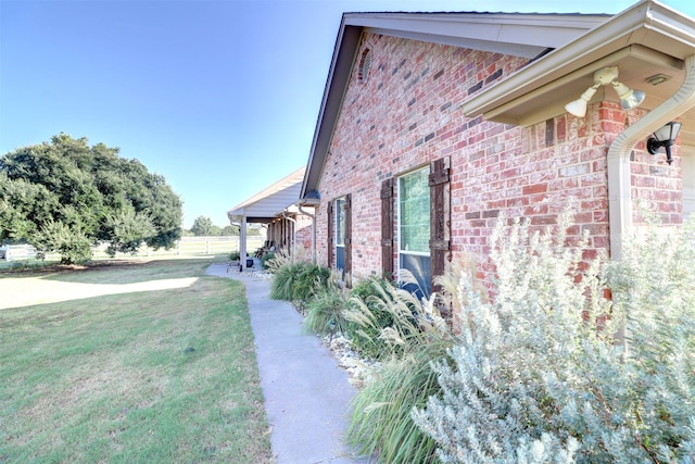 view of side of property featuring a yard