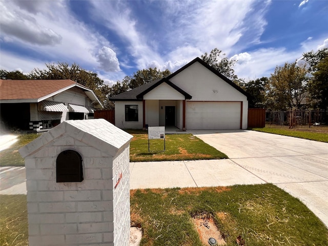 view of front of home featuring a garage and a front lawn