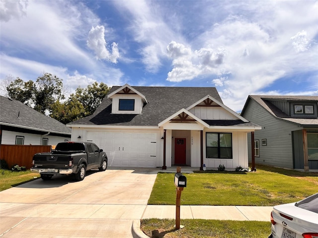 view of front of home with a garage and a front yard