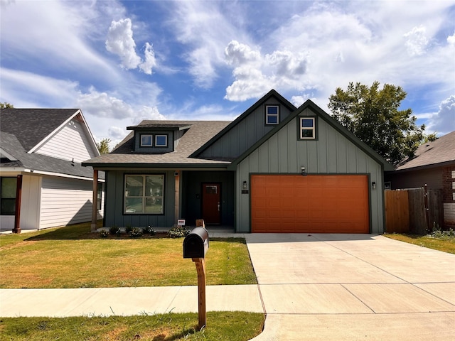 view of front of house with a garage and a front yard