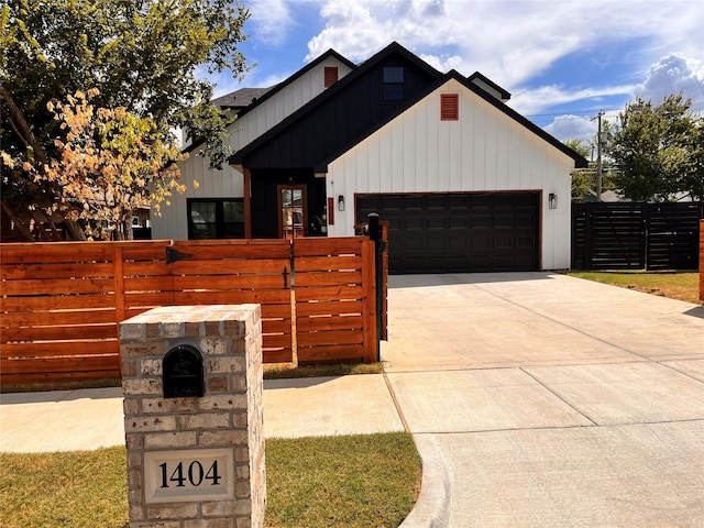 modern farmhouse style home featuring a garage