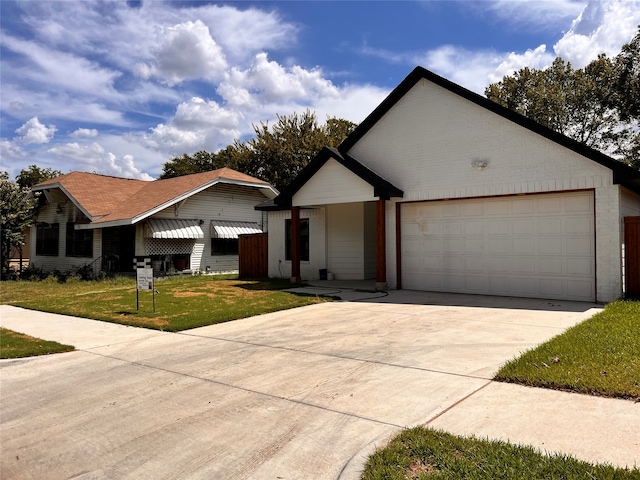 ranch-style home featuring a garage and a front lawn