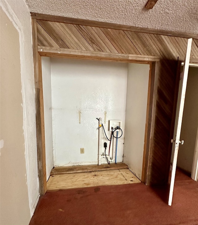 clothes washing area with hookup for a washing machine, carpet floors, wooden walls, and wood ceiling