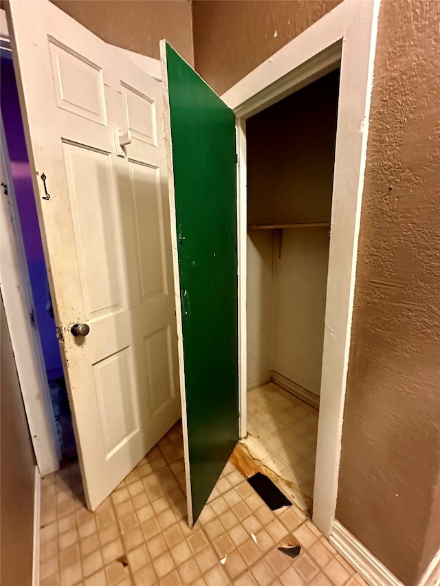 bathroom with tile patterned floors