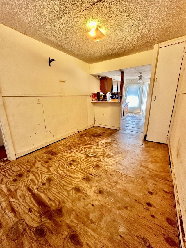 interior space with a textured ceiling