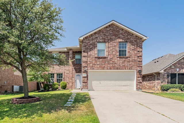 view of front property with a garage and a front lawn