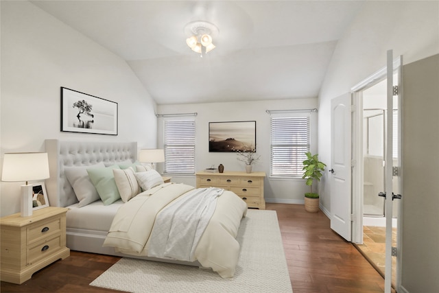 bedroom featuring dark hardwood / wood-style floors and vaulted ceiling