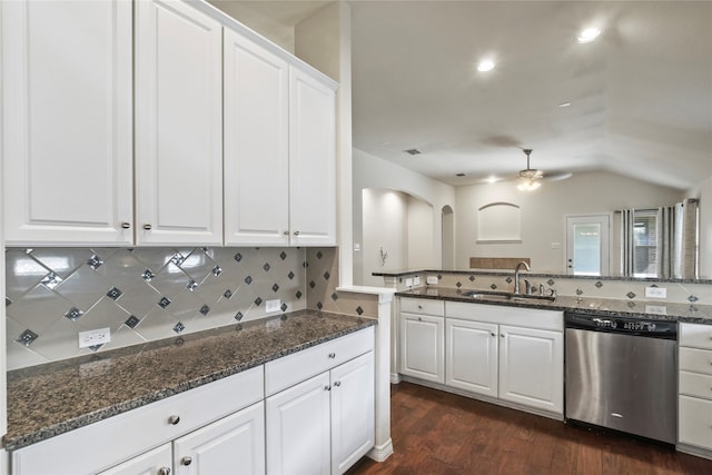 kitchen with sink, dishwasher, white cabinets, dark stone countertops, and dark hardwood / wood-style floors