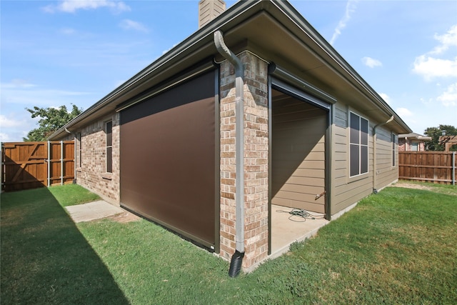 view of property exterior with a lawn