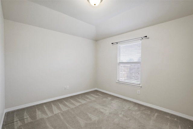 unfurnished room with light colored carpet