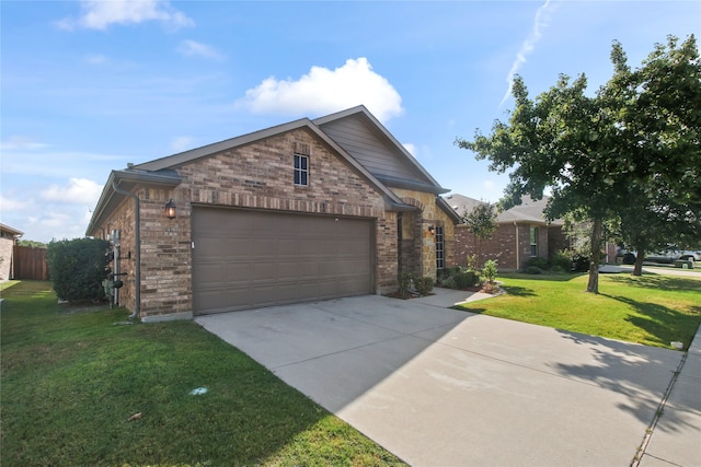 view of front of home with a front lawn and a garage