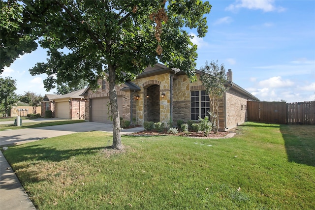 view of front facade with a front lawn and a garage