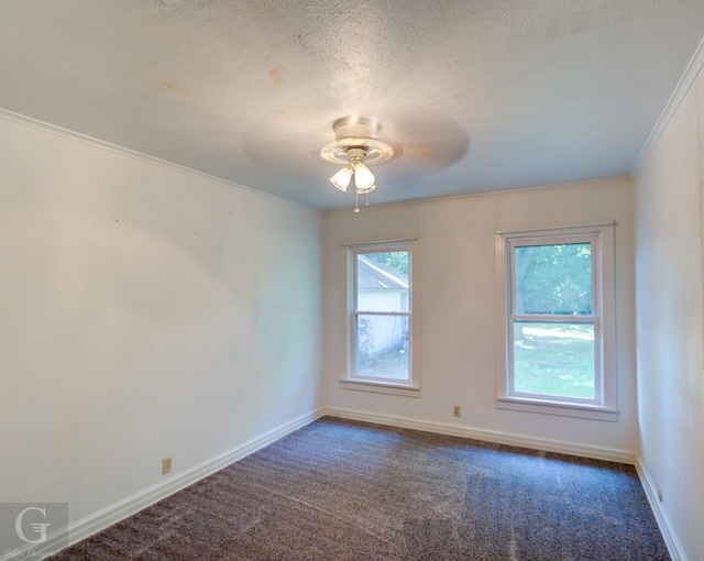 carpeted spare room featuring ceiling fan, crown molding, and a textured ceiling