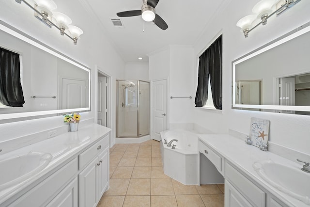 bathroom featuring vanity, ceiling fan, tile patterned floors, and plus walk in shower