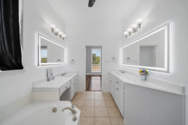 bathroom with a bath, dual bowl vanity, hardwood / wood-style flooring, and crown molding