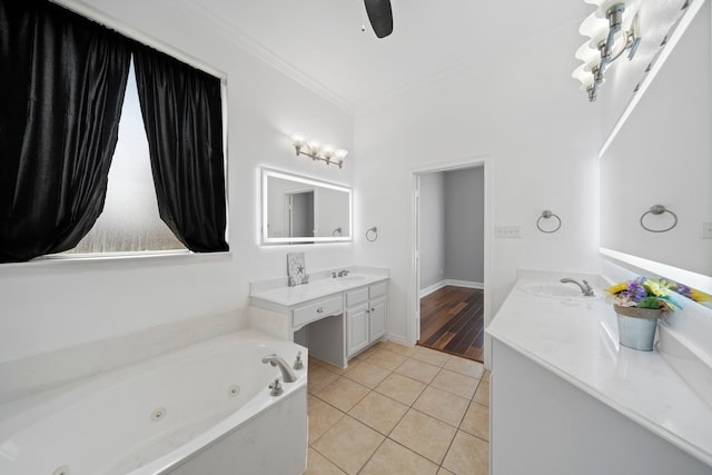 bathroom with ornamental molding, a tub to relax in, dual vanity, and hardwood / wood-style floors