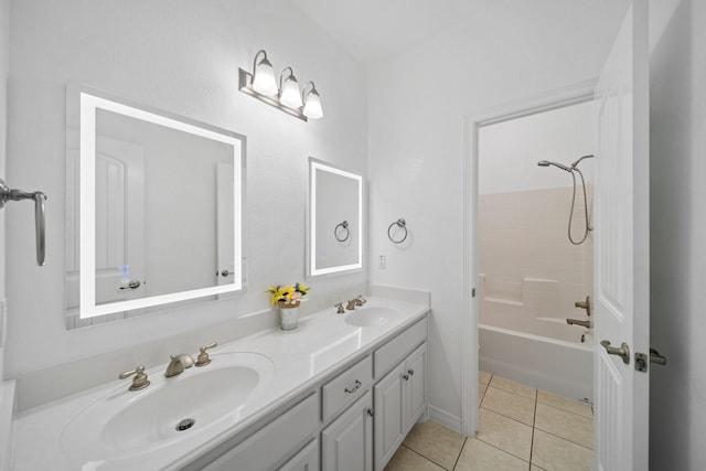 bathroom with double vanity, tile patterned flooring, a sink, and shower / tub combination