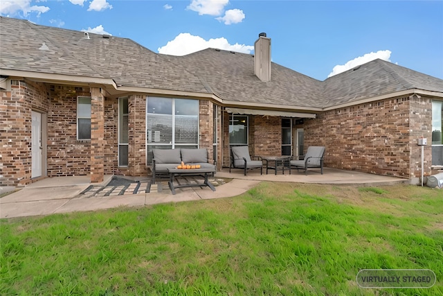 rear view of property featuring a patio, brick siding, an outdoor living space, a yard, and roof with shingles