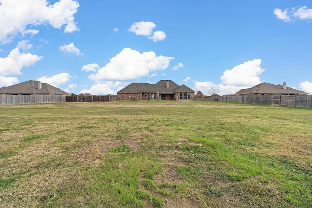 view of yard with a fenced backyard