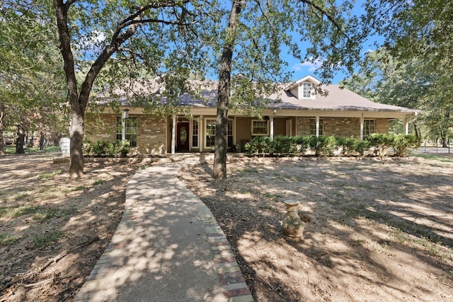 view of front of property featuring brick siding