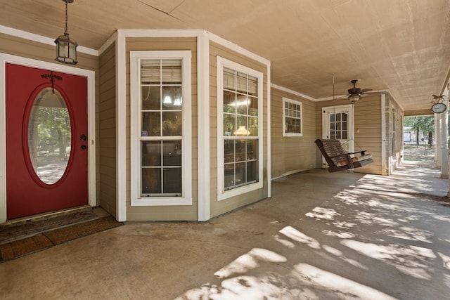 entrance to property with ceiling fan