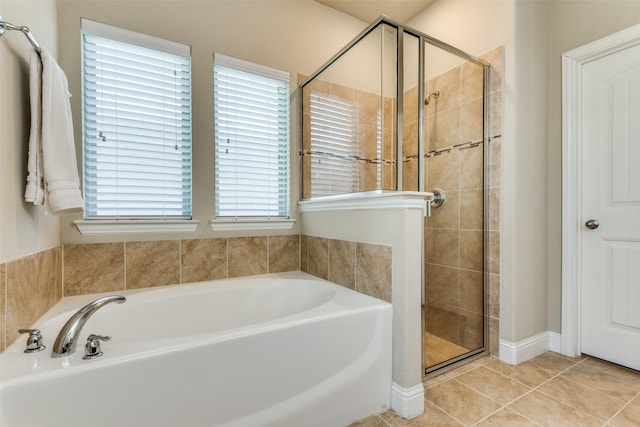 bathroom featuring tile patterned floors and independent shower and bath