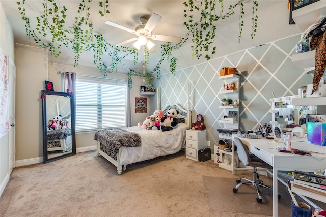 carpeted bedroom with baseboards and a ceiling fan