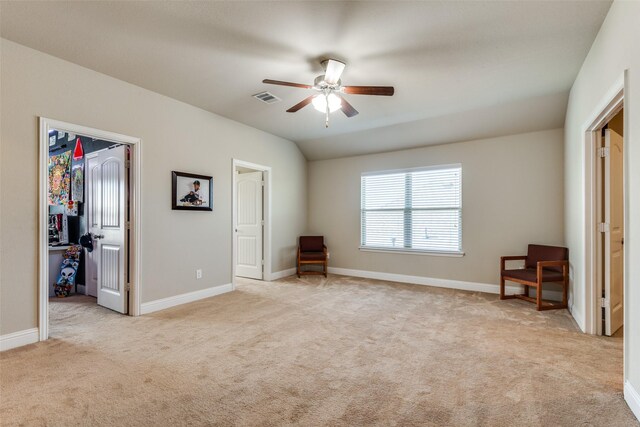 unfurnished bedroom featuring ceiling fan and light carpet