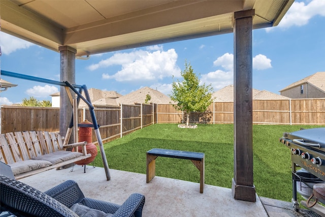 view of patio featuring a fenced backyard and grilling area