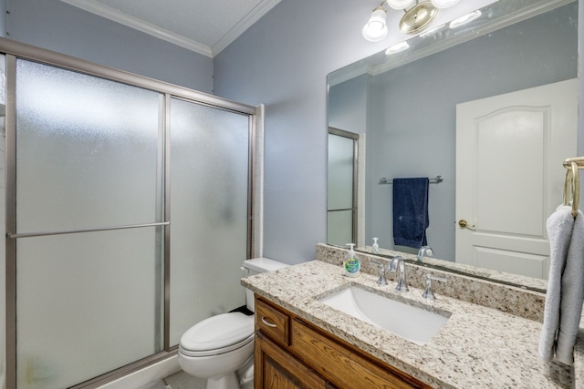 bathroom featuring vanity, toilet, an enclosed shower, and ornamental molding