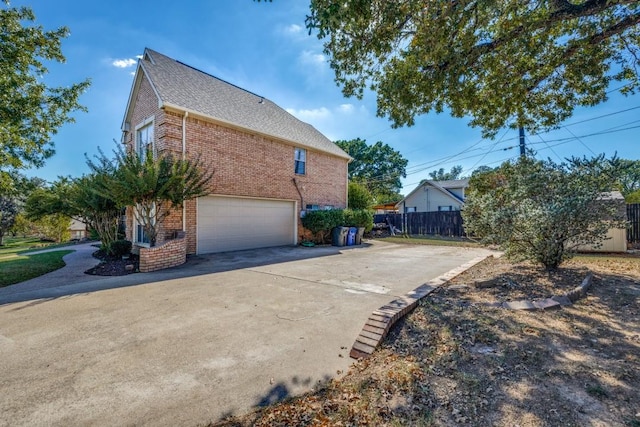 view of side of property featuring a garage