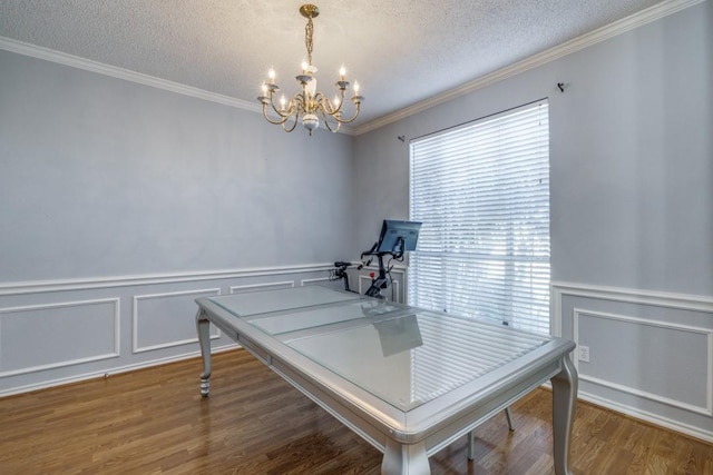 office space featuring hardwood / wood-style flooring, a textured ceiling, a wealth of natural light, and a chandelier