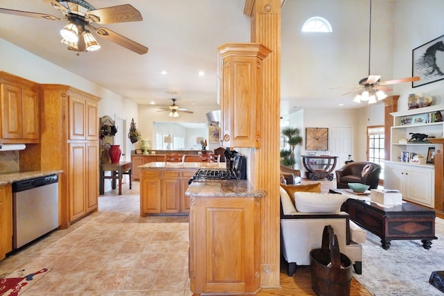 kitchen featuring tasteful backsplash, light stone counters, range, stainless steel dishwasher, and kitchen peninsula