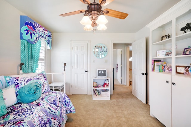 carpeted bedroom featuring ceiling fan