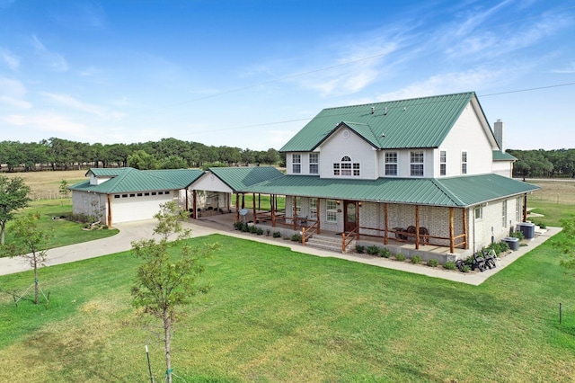 view of front of property featuring a porch, a garage, a front yard, and central AC unit