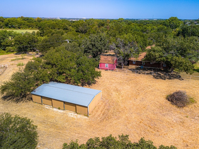 birds eye view of property with a rural view