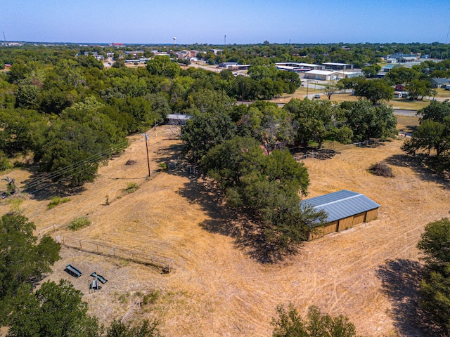 birds eye view of property with a rural view