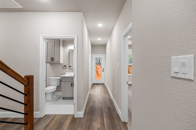 hallway featuring dark hardwood / wood-style flooring