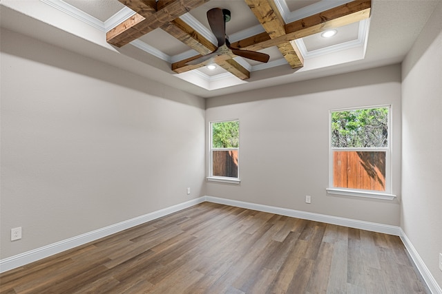 unfurnished room with a healthy amount of sunlight, wood-type flooring, and coffered ceiling