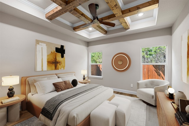 bedroom featuring multiple windows, coffered ceiling, hardwood / wood-style floors, and beam ceiling