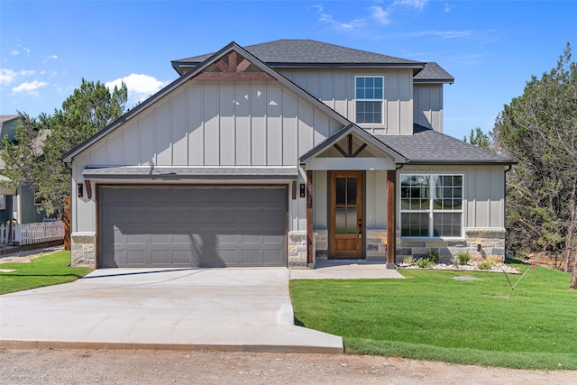 view of front of house with a front lawn and a garage