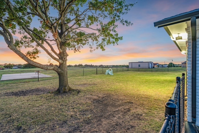 yard at dusk with a rural view