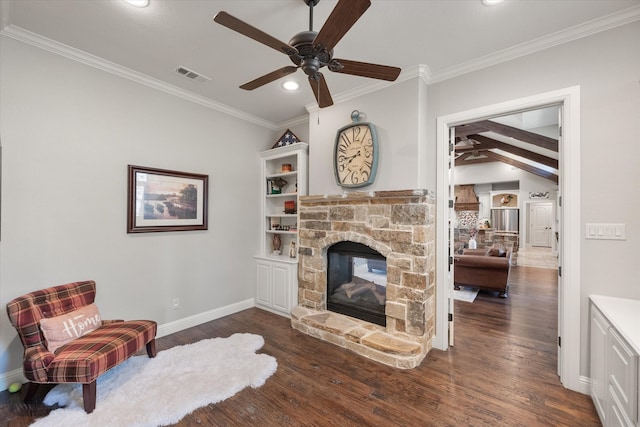 living room featuring a fireplace, ceiling fan, dark wood-type flooring, and ornamental molding