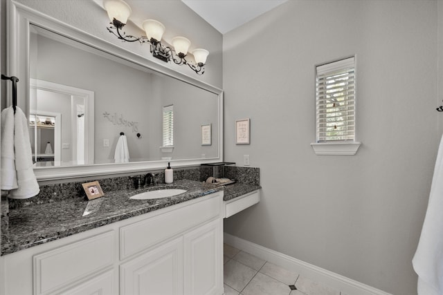 bathroom with tile patterned floors and vanity