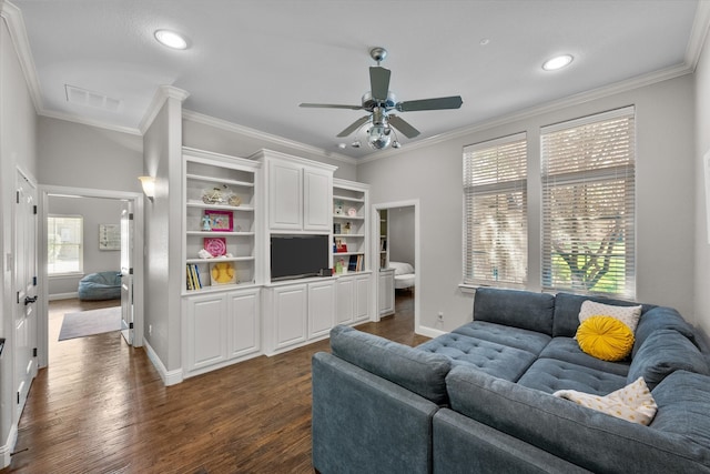 living room featuring ceiling fan, dark wood-type flooring, and crown molding