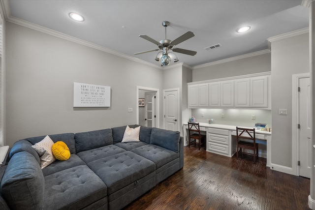 living room featuring ceiling fan, built in desk, hardwood / wood-style flooring, and ornamental molding