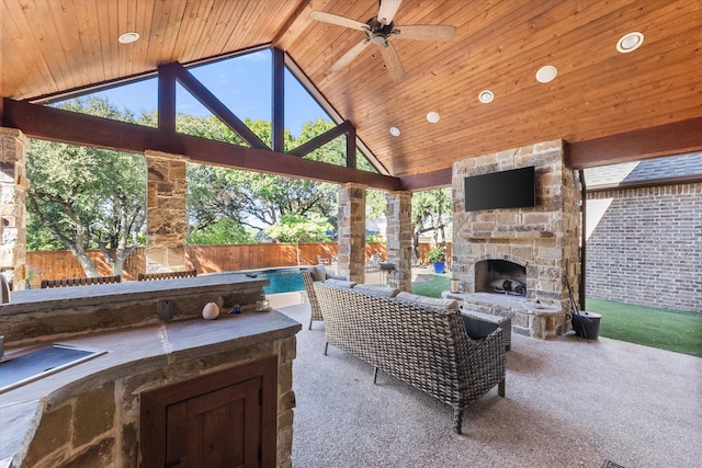 view of patio with ceiling fan, a gazebo, an outdoor stone fireplace, and a fenced in pool