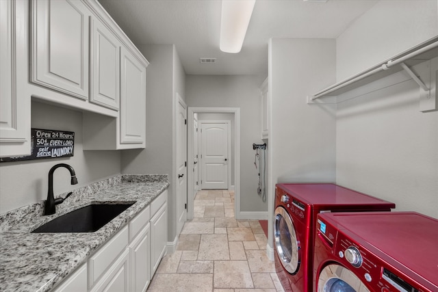 washroom featuring sink, cabinets, independent washer and dryer, and light tile patterned floors